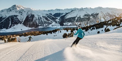 Skiregion - Trentino-Südtirol - Höllentalabfahrt mit Blick auf den Reschensee - Skigebiet Schöneben-Haideralm